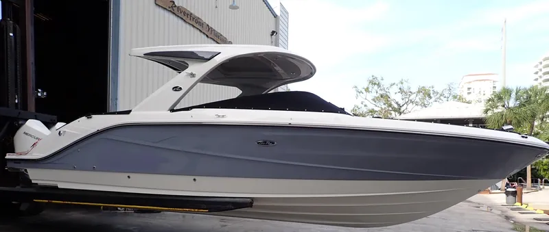  Yacht Photos Pics 2024 Sea Ray SLX 310 OB boat docked, featuring sleek design and modern amenities.