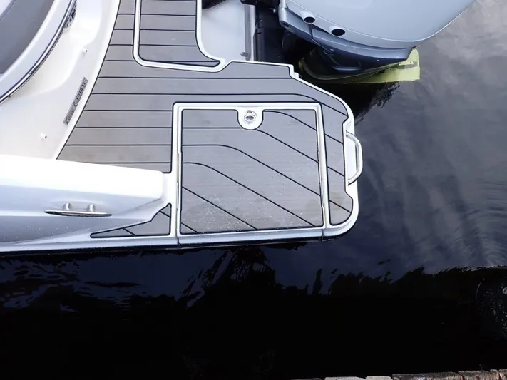  Yacht Photos Pics 2024 Sea Ray SLX 310 OB boat deck with sleek design and modern outboard motor.