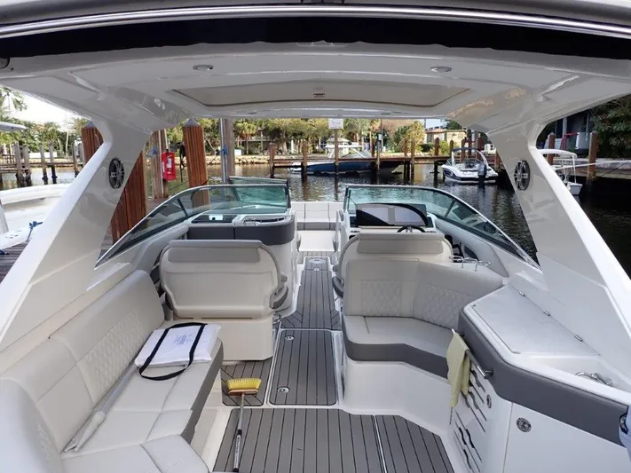  Yacht Photos Pics 2024 Sea Ray SLX 310 OB boat interior with luxurious seating and modern design.