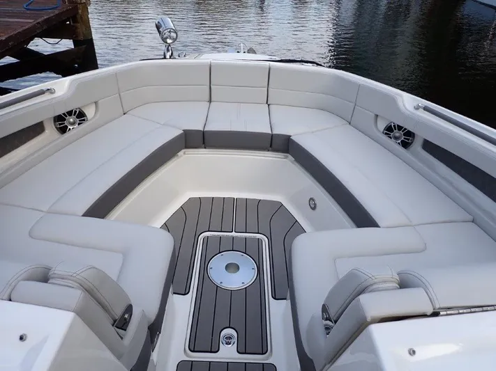  Yacht Photos Pics 2024 Sea Ray SLX 310 OB boat interior with spacious seating and elegant design.