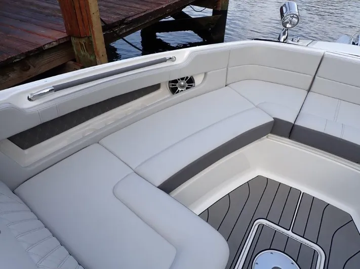  Yacht Photos Pics 2024 Sea Ray SLX 310 OB boat interior with cushioned seating and sleek design.