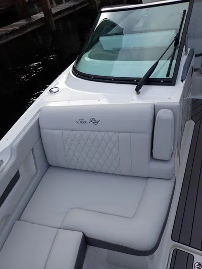  Yacht Photos Pics 2024 Sea Ray SLX 310 OB boat with luxurious seating and sleek design.