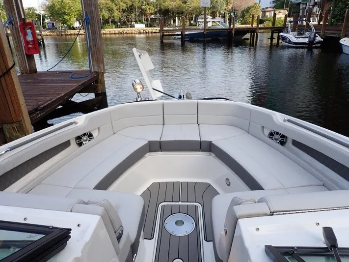  Yacht Photos Pics 2024 Sea Ray SLX 310 OB boat interior with spacious seating and elegant design.