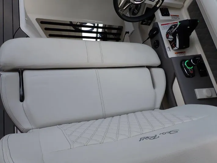  Yacht Photos Pics 2024 Sea Ray SLX 310 OB boat interior with white seating and control panel.