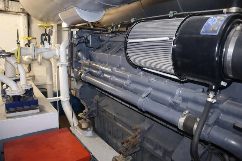  Yacht Photos Pics Engine room of 2008 De Donge Long Range 48M yacht, showcasing machinery and piping.