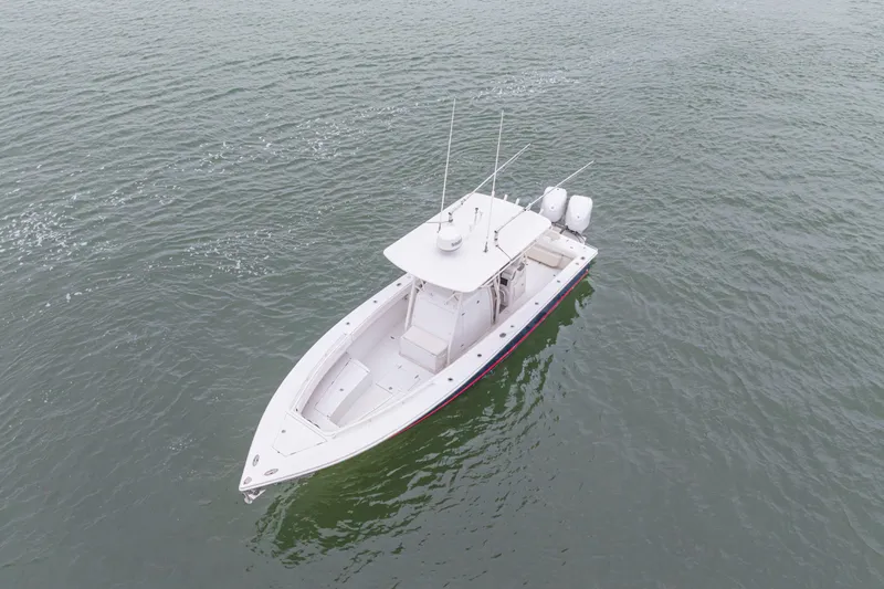  Yacht Photos Pics 2008 Jupiter 31 FS boat on calm water, aerial view.
