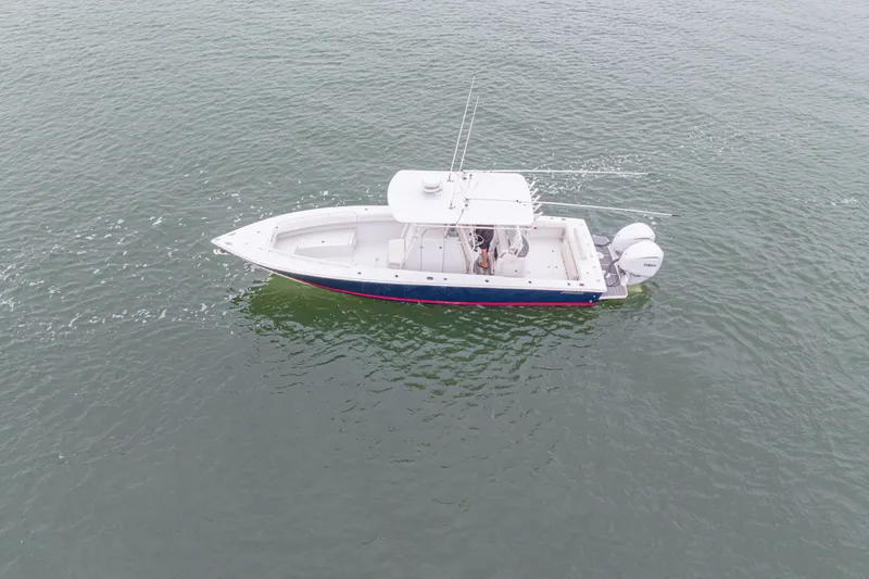  Yacht Photos Pics Aerial view of 2008 Jupiter 31 FS boat on calm water.