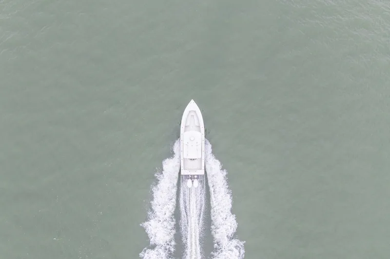  Yacht Photos Pics Aerial view of 2008 Jupiter 31 FS boat cruising on open water.