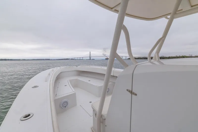  Yacht Photos Pics 2008 Jupiter 31 FS boat on water with bridge in background.