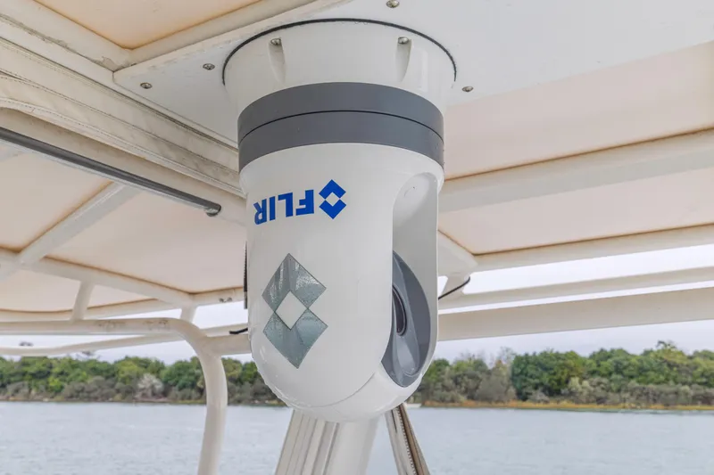  Yacht Photos Pics FLIR camera mounted on a 2008 Jupiter 31 FS boat, under a canopy.