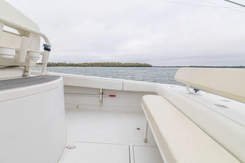  Yacht Photos Pics 2008 Jupiter 31 FS boat interior with seating, overlooking calm waters and distant shoreline.