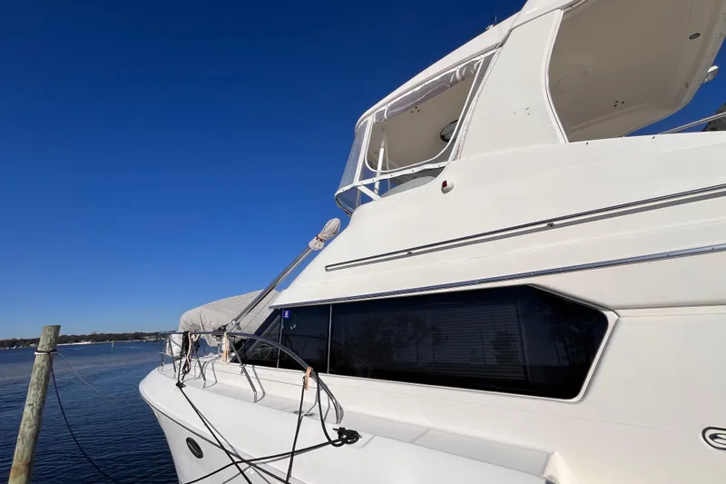  Yacht Photos Pics 2001 Silverton 42C yacht docked under clear blue sky.