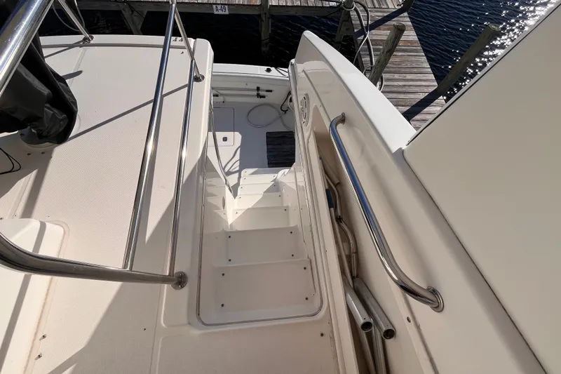  Yacht Photos Pics Staircase on 2001 Silverton 42C yacht leading to dock, featuring stainless steel railings.