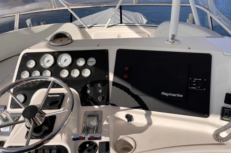  Yacht Photos Pics Helm of 2001 Silverton 42C yacht with Raymarine navigation system and gauges.