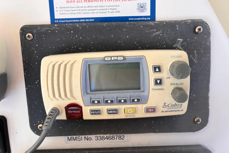  Yacht Photos Pics Cobra Marine GPS radio on 2001 Silverton 42C boat dashboard with distress button.