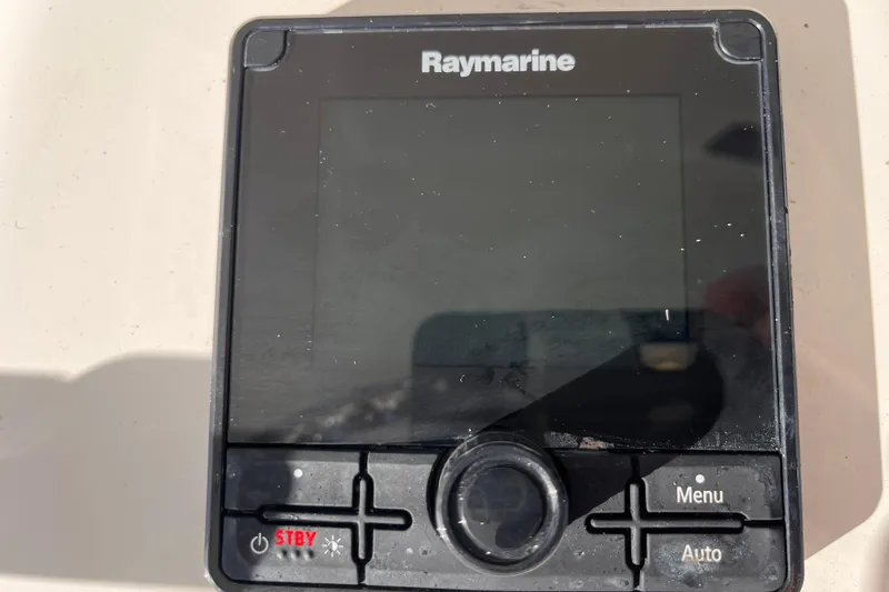  Yacht Photos Pics Raymarine control panel on a 2001 Silverton 42C boat, featuring menu and auto buttons.