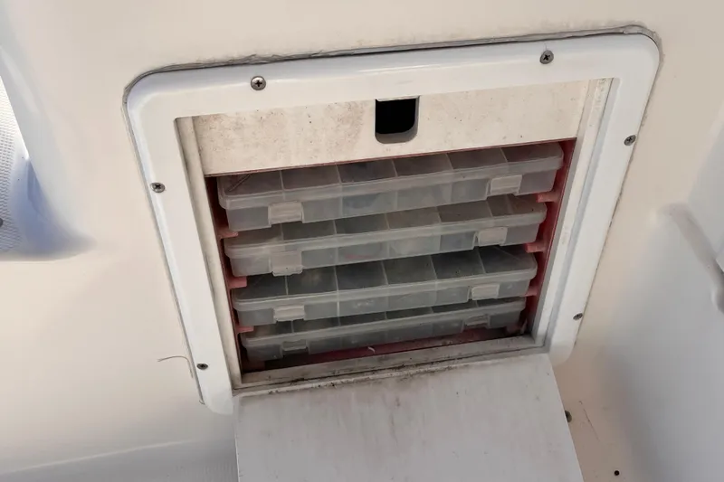  Yacht Photos Pics Storage compartment with plastic tackle boxes on a 2001 Silverton 42C boat.