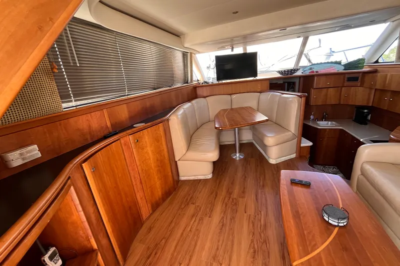  Yacht Photos Pics Luxurious interior of 2001 Silverton 42C yacht with wood finish and cozy seating area.