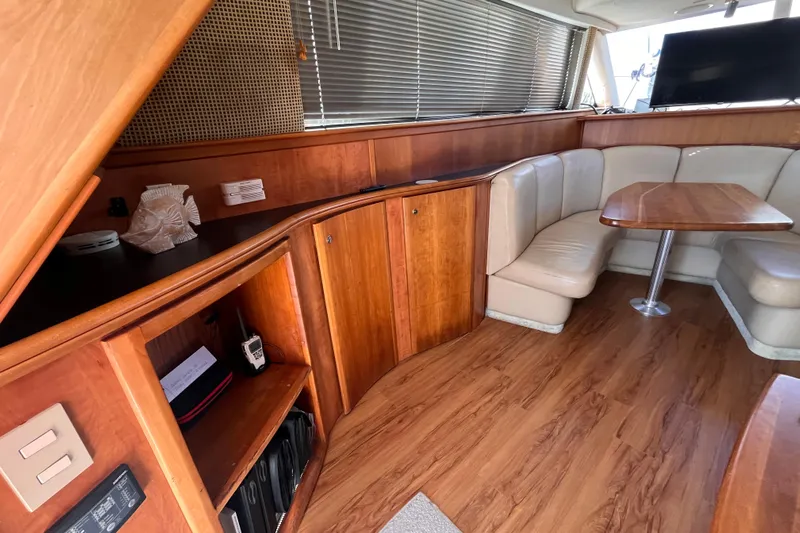  Yacht Photos Pics Luxurious 2001 Silverton 42C yacht interior with wood finish and cozy seating area.