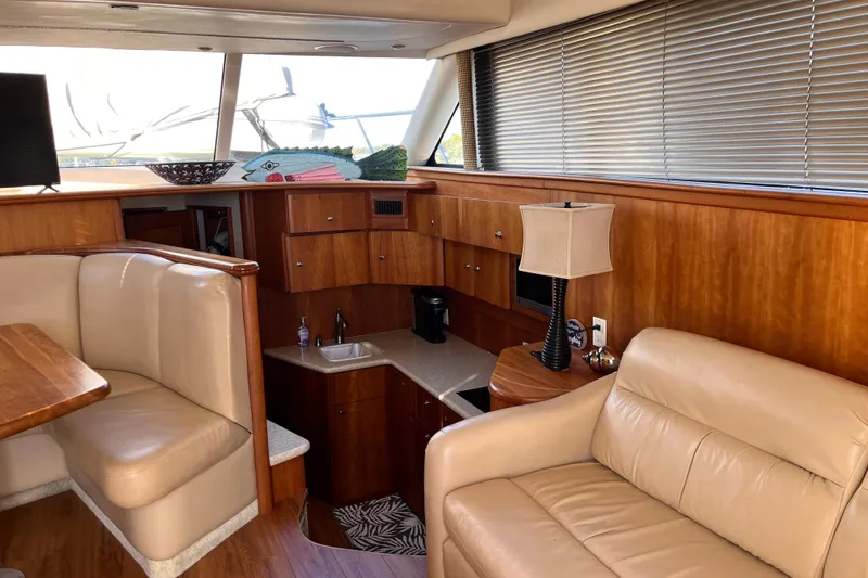  Yacht Photos Pics Interior of 2001 Silverton 42C yacht with leather seating and wooden cabinetry.