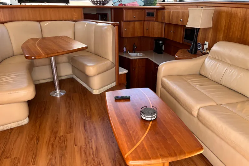  Yacht Photos Pics Interior of 2001 Silverton 42C yacht with leather seating and wooden furnishings.