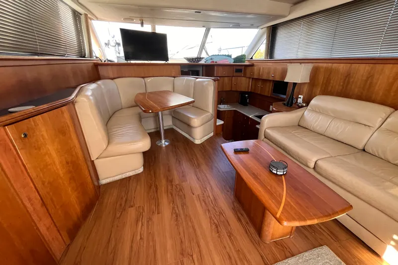  Yacht Photos Pics Luxurious interior of a 2001 Silverton 42C yacht with leather seating and wood finishes.