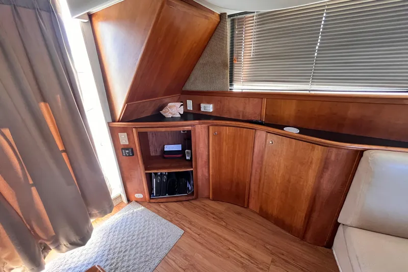  Yacht Photos Pics Interior of 2001 Silverton 42C yacht with wooden cabinetry and blinds.