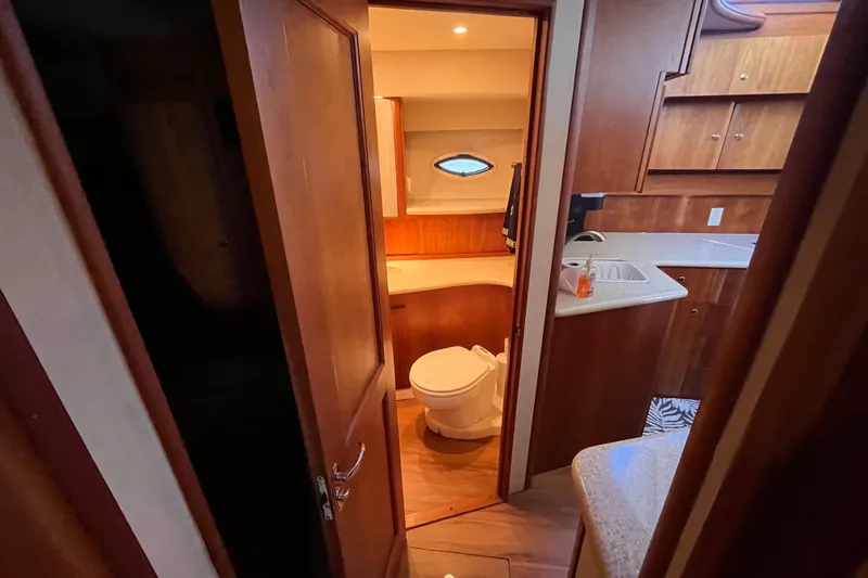  Yacht Photos Pics Interior of 2001 Silverton 42C yacht showing bathroom and kitchenette area.