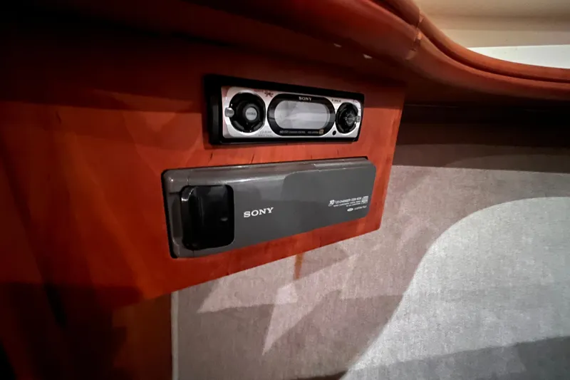  Yacht Photos Pics Sony audio system in 2001 Silverton 42C boat interior, featuring wood paneling.
