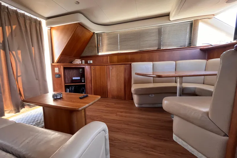  Yacht Photos Pics Luxurious interior of a 2001 Silverton 42C yacht with wood accents and leather seating.