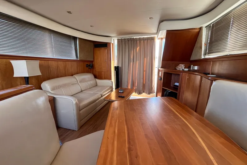  Yacht Photos Pics Interior of 2001 Silverton 42C yacht with wooden furnishings and leather seating.