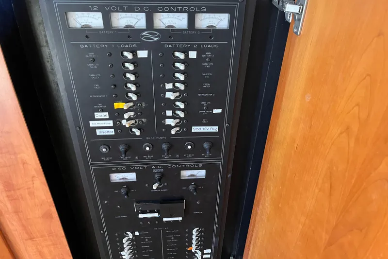  Yacht Photos Pics Electrical control panel on a 2001 Silverton 42C boat, featuring 12V DC and 240V AC controls.