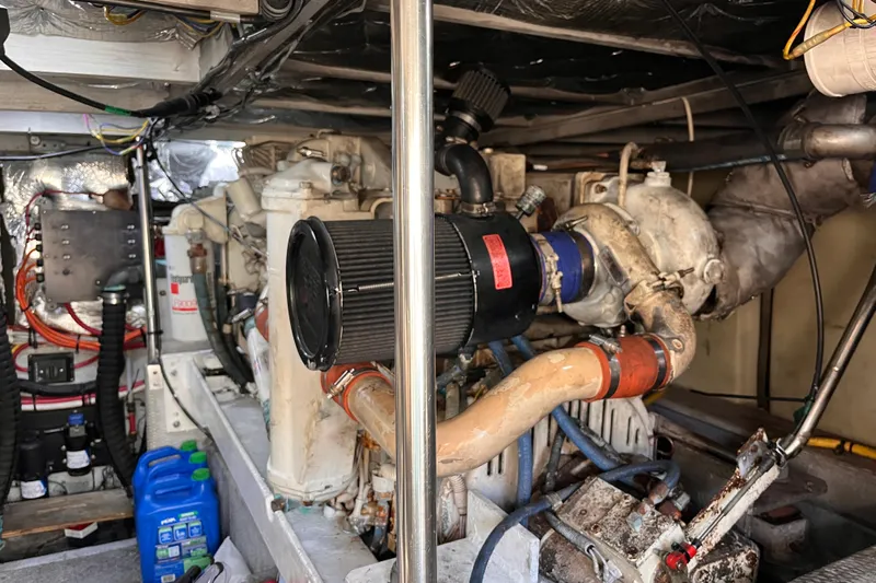  Yacht Photos Pics Engine room of a 2001 Silverton 42C boat, showcasing mechanical components and wiring.