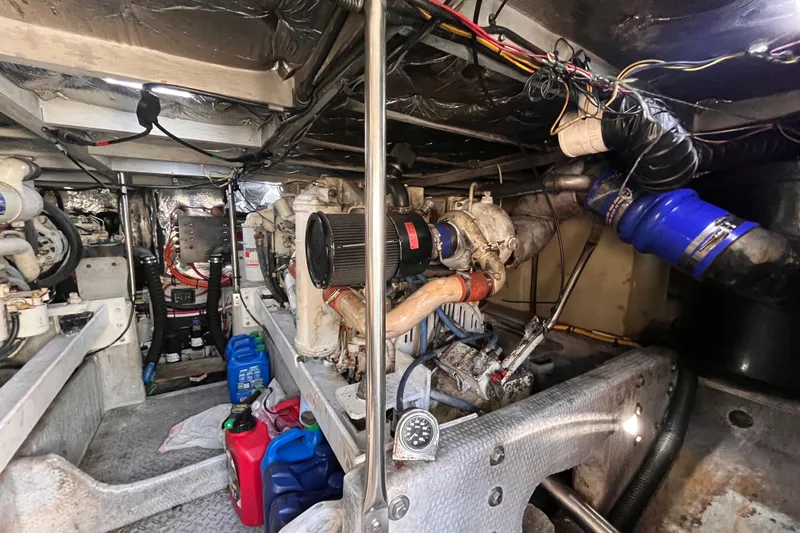  Yacht Photos Pics Engine room of a 2001 Silverton 42C boat, showcasing mechanical components and wiring.