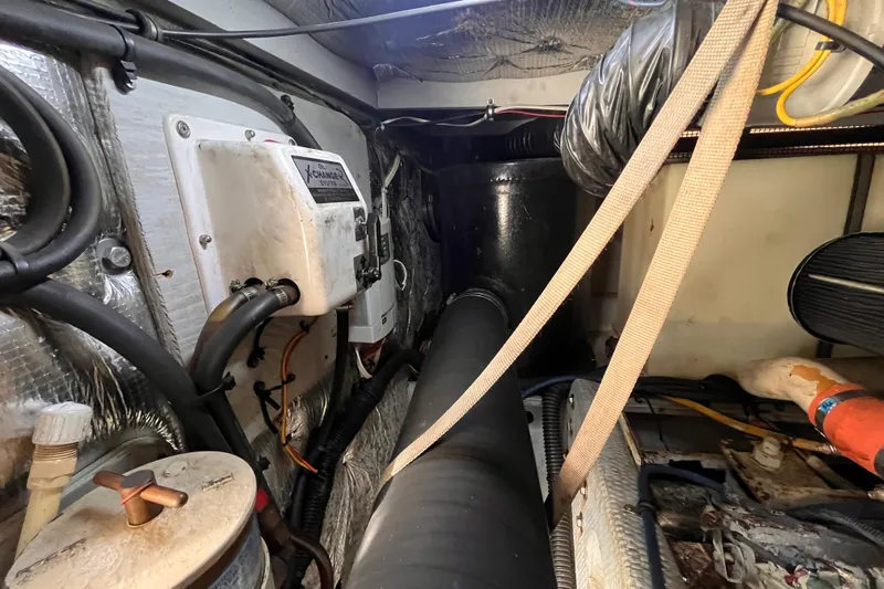  Yacht Photos Pics Engine room of a 2001 Silverton 42C boat, showing mechanical components and wiring.