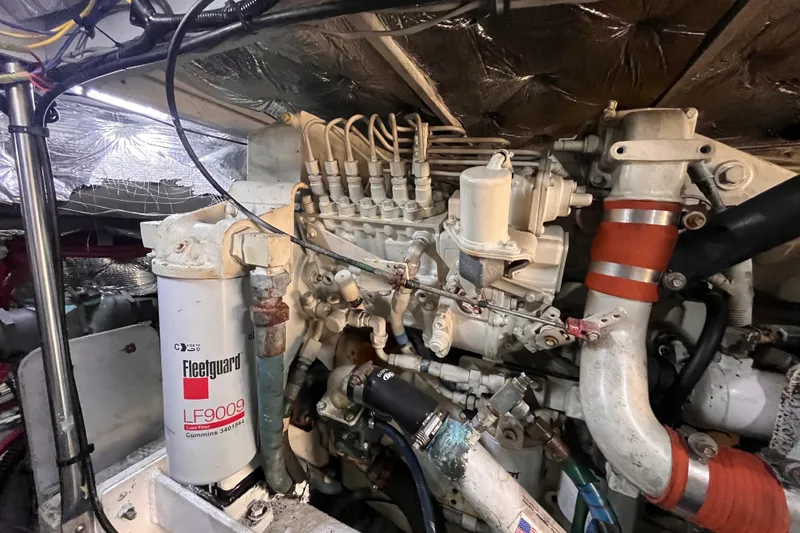  Yacht Photos Pics Engine compartment of a 2001 Silverton 42C boat, featuring a Fleetguard LF9009 filter.