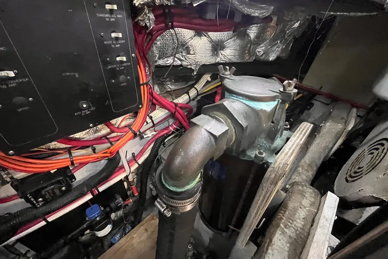  Yacht Photos Pics Engine room of a 2001 Silverton 42C boat, showing wiring and mechanical components.