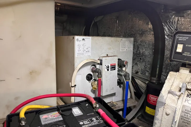  Yacht Photos Pics Engine room of a 2001 Silverton 42C boat with battery and wiring.