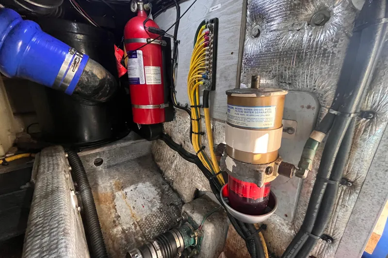  Yacht Photos Pics Engine room of 2001 Silverton 42C with fire extinguisher and fuel filter system.