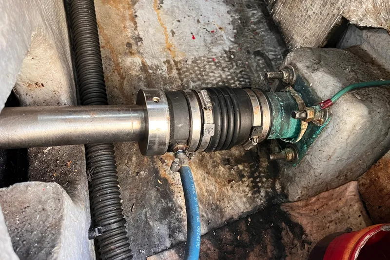  Yacht Photos Pics Boat shaft assembly in a 2001 Silverton 42C, showing metal and rubber components.