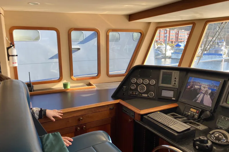 Nomad Yacht Photos Pics Pilothouse interior of 2003 Northern Marine 57 Raised Pilothouse yacht with navigation equipment.