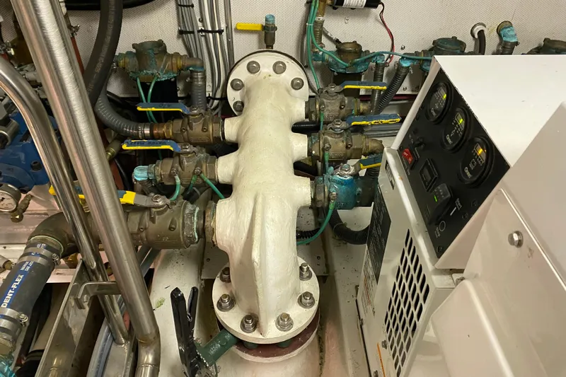 Nomad Yacht Photos Pics Engine room of 2003 Northern Marine 57 Raised Pilothouse with gauges and valves.