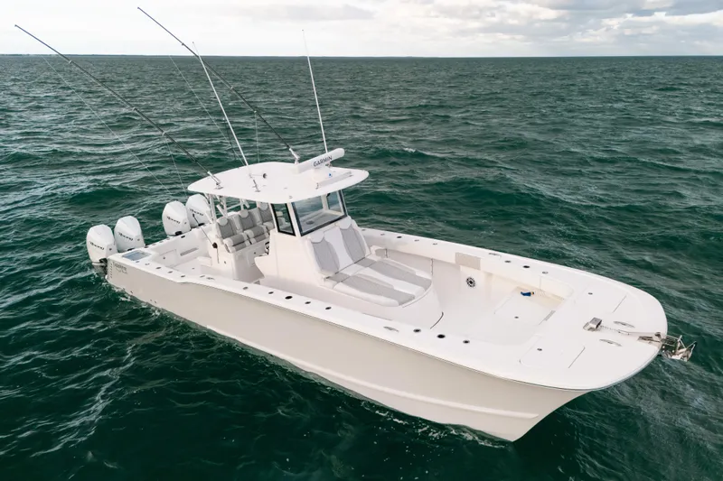  Yacht Photos Pics 2024 Tideline 365 boat on open water, featuring multiple outboard engines.