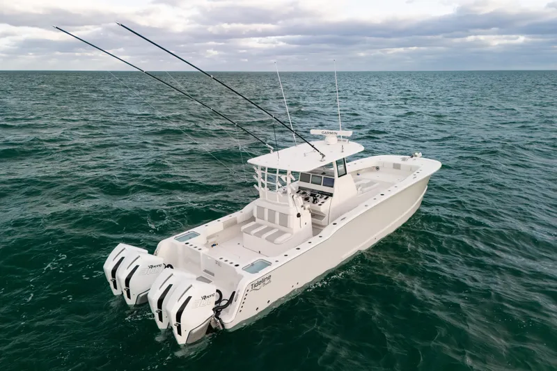  Yacht Photos Pics 2024 Tideline 365 boat on open sea with dual engines and fishing rods.