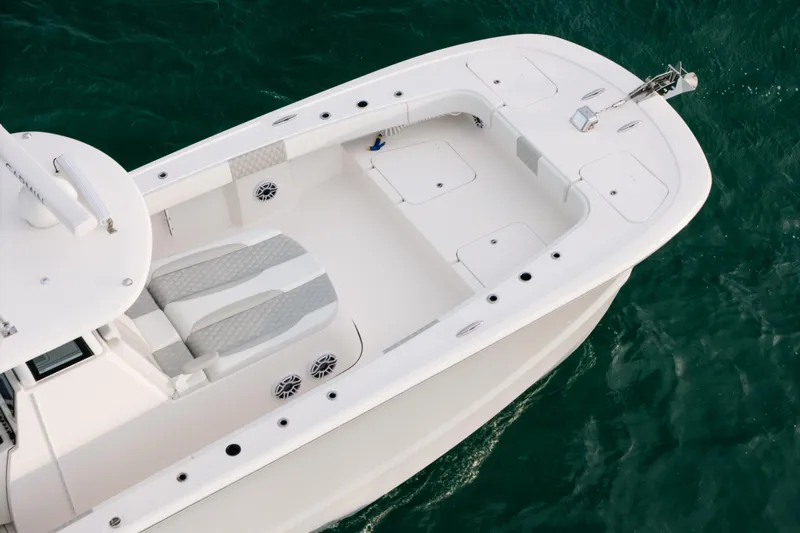  Yacht Photos Pics 2024 Tideline 365 boat, aerial view, white deck, on clear water.