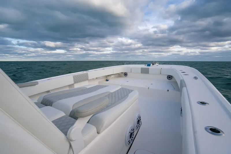  Yacht Photos Pics 2024 Tideline 365 boat on open sea under cloudy sky.