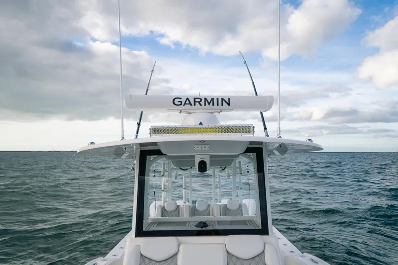  Yacht Photos Pics 2024 Tideline 365 boat with Garmin equipment on open water under cloudy sky.