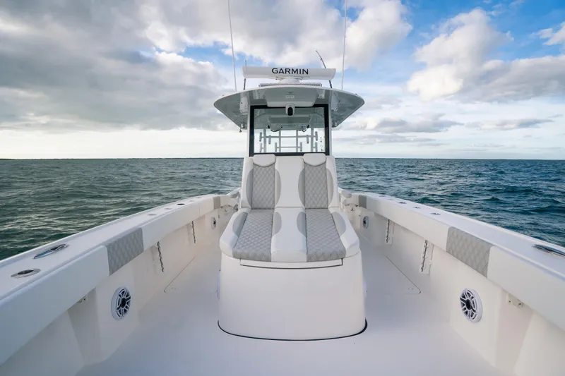  Yacht Photos Pics 2024 Tideline 365 boat on open sea under cloudy sky.