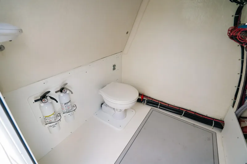  Yacht Photos Pics Interior of 2024 Tideline 365 boat with toilet and fire extinguishers.