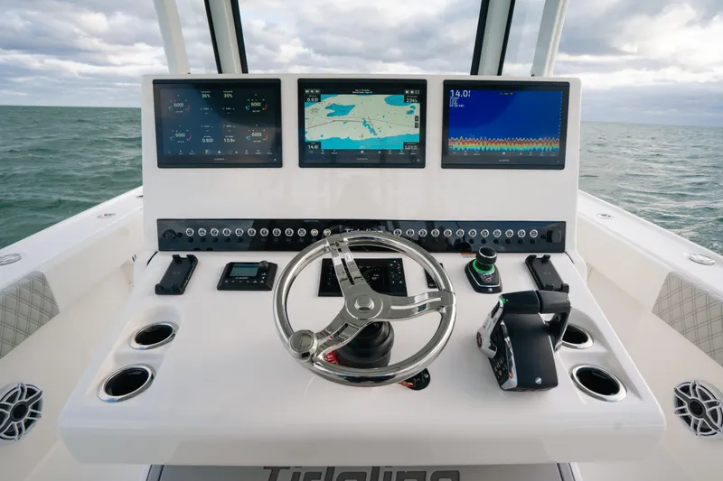  Yacht Photos Pics 2024 Tideline 365 boat dashboard with advanced navigation and control systems on open water.